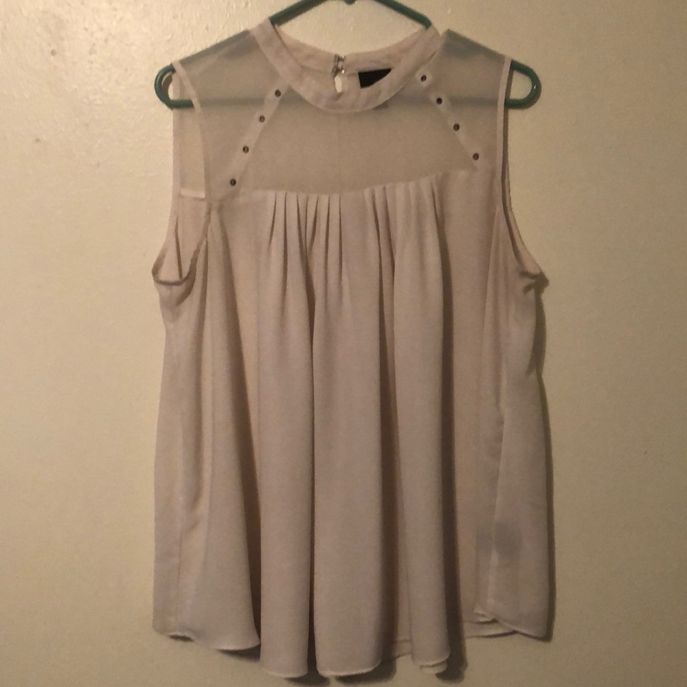 Cute blouse with a see through top.